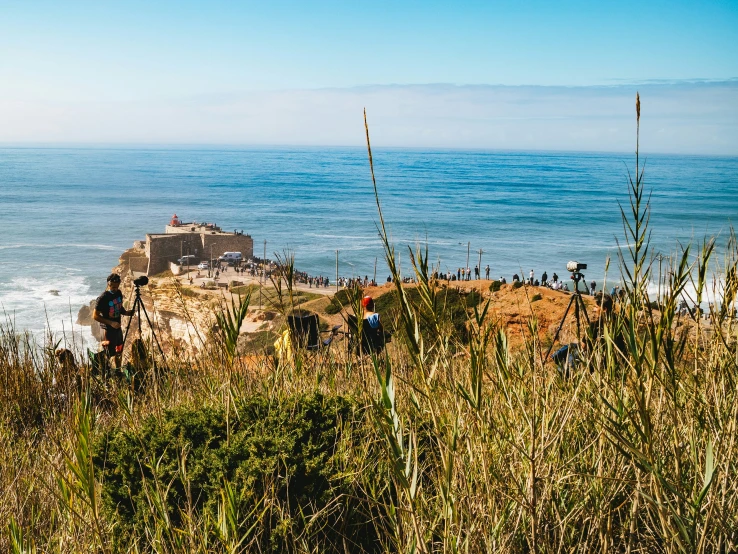 the view of an ocean and a rocky cliff