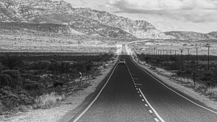 a black and white po of an empty highway