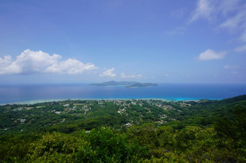 the landscape is beautiful and green, with blue skies