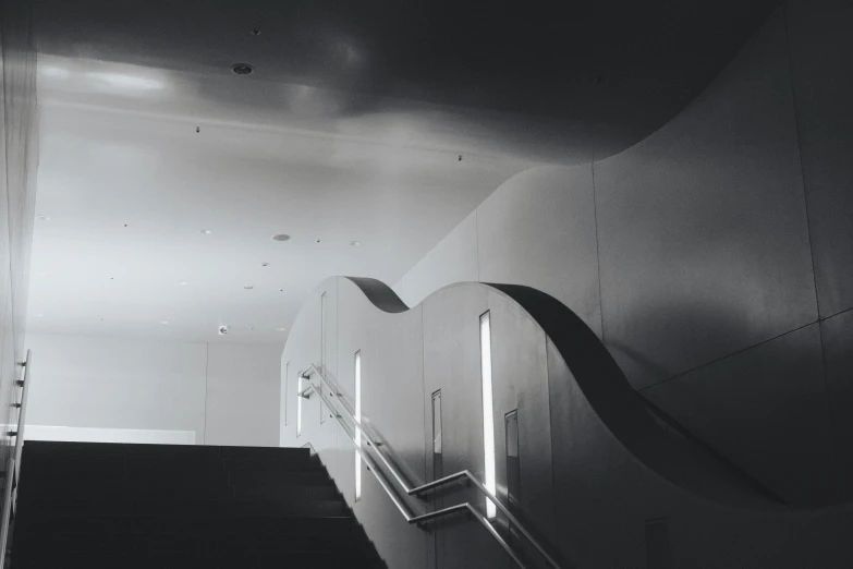 two long escalators going down and a light on