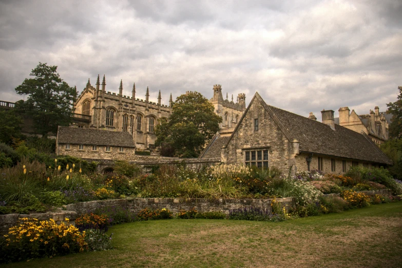 a castle style building with gardens in front of it