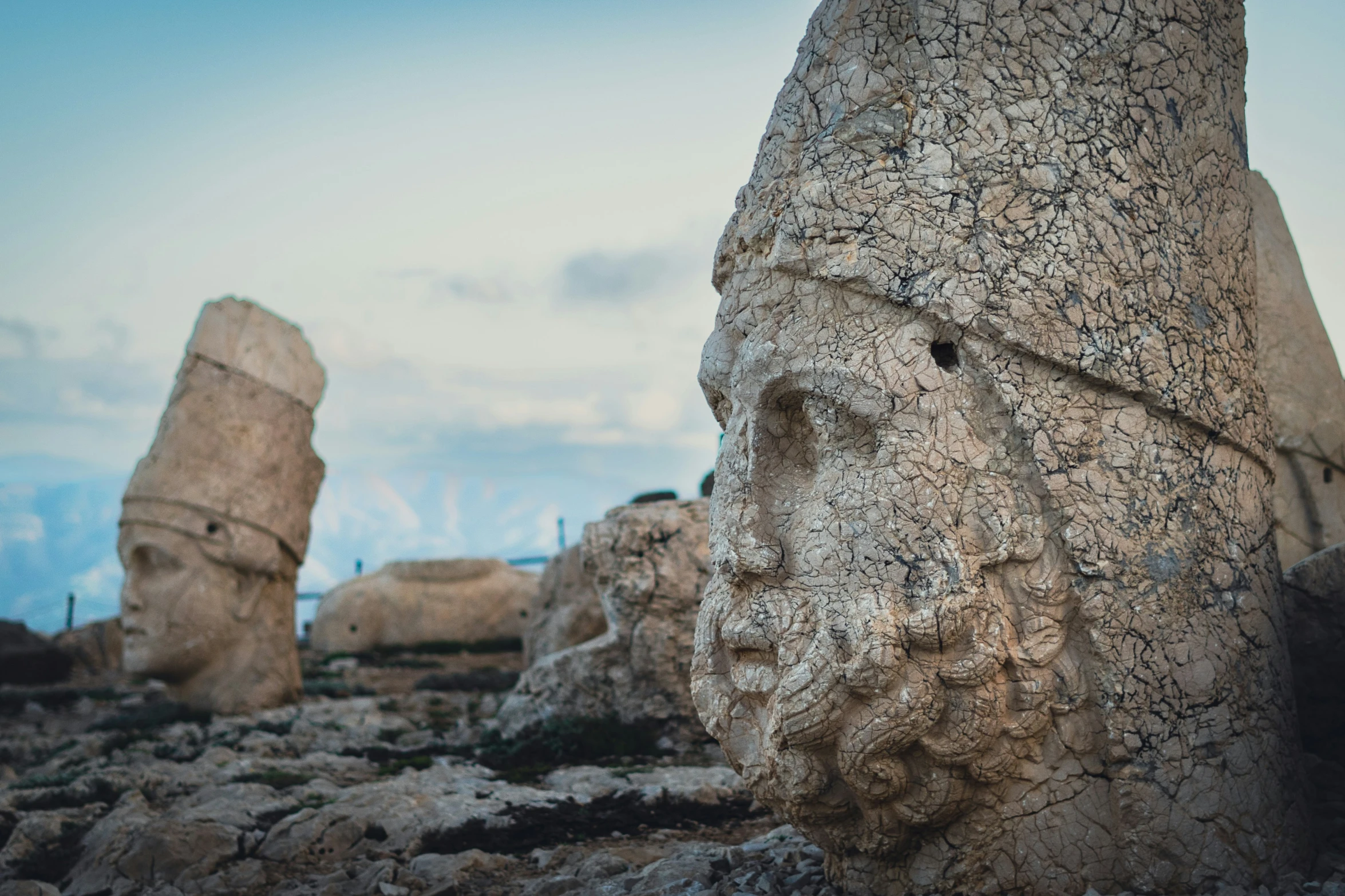 the large head of a person on some rocks