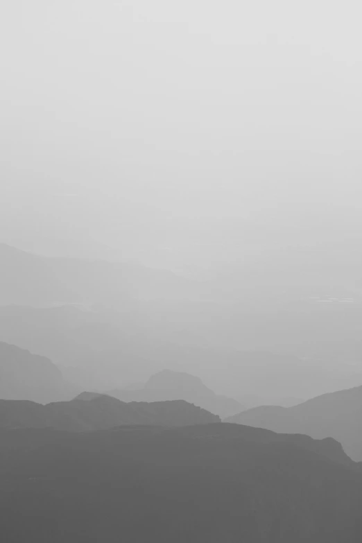 hazy mountain scene with a black and white po