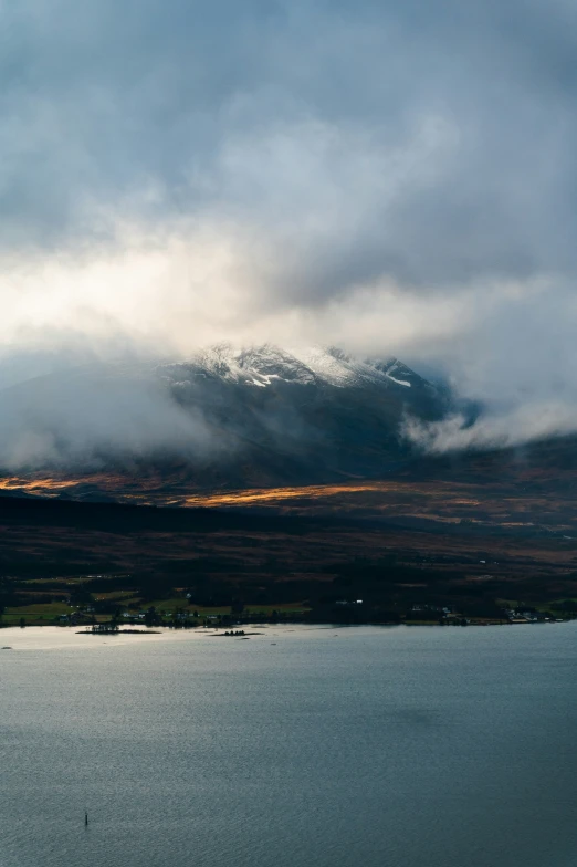 a view of a large body of water under a cloudy sky