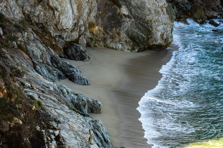 an image of beach setting and rocks