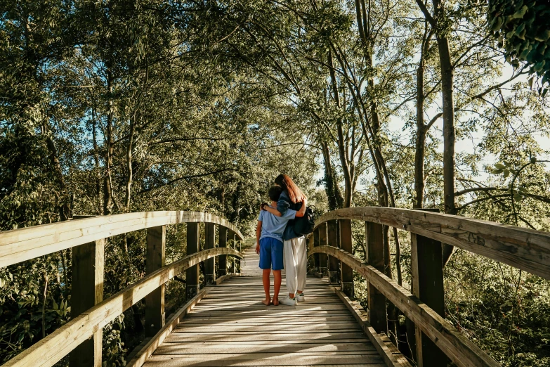 a woman carrying her husband on a path