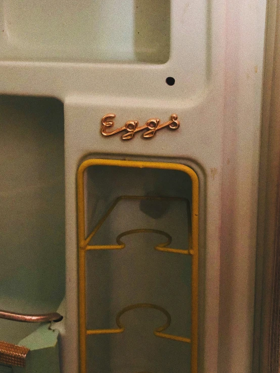 view of inside of toilet with metal divider and yellow door