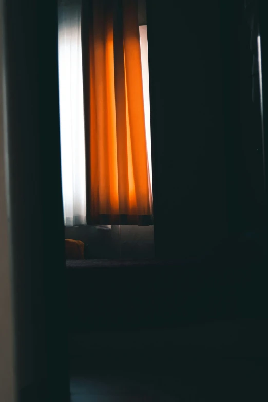 a window in an interior with some bright curtains