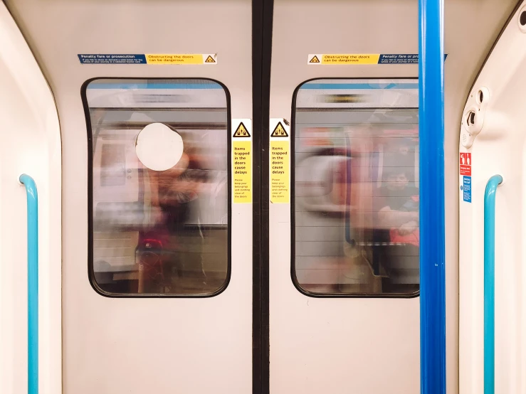 passengers walking along the rail cars near each other