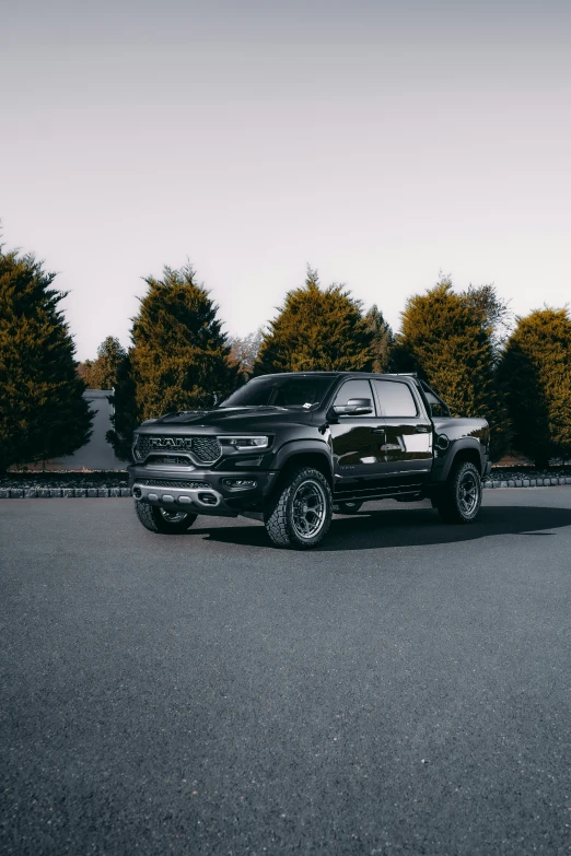 a black pickup truck parked on the side of the road