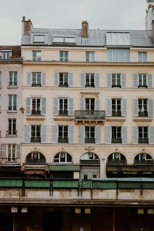 several buildings near each other with white shutters