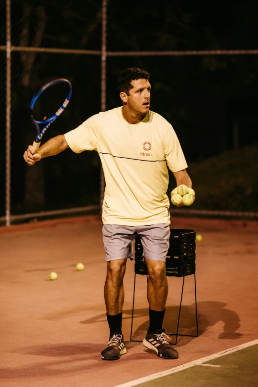 a tennis player is ready to hit the ball with his racket