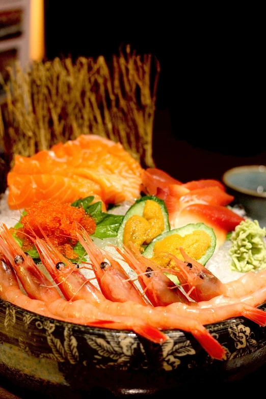 a close up of a plate of fish and vegetables