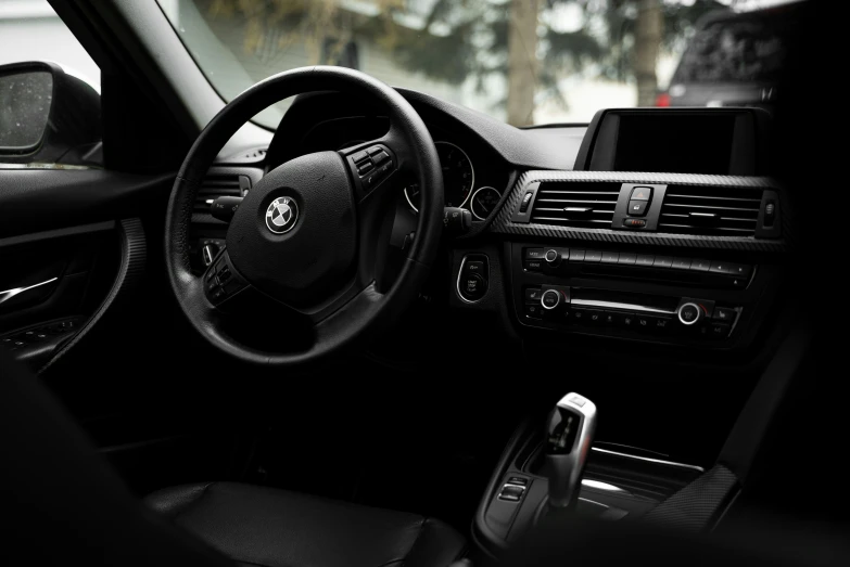 view from inside a car steering wheel, dashboard and passenger dashboard