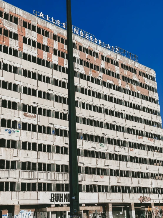 an old building with open windows in a city