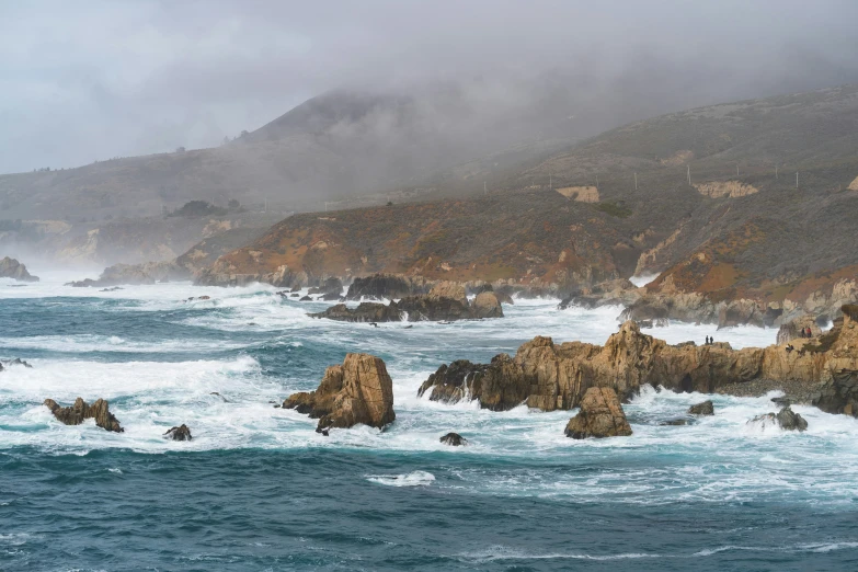 large body of water surrounded by rocky coastline