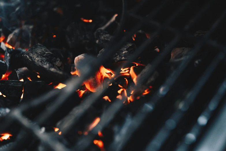 there is a bunch of meat grilling on the grill