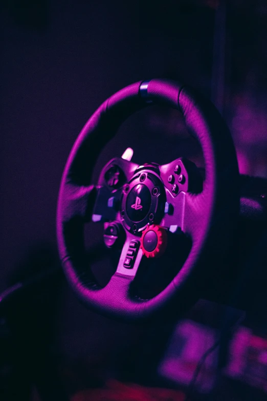 a steering wheel with a red needle is shown