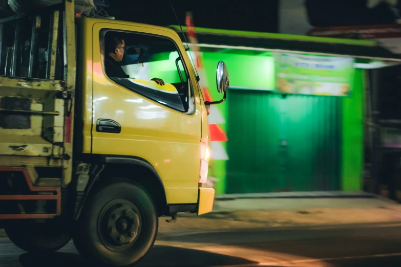 a man drives a truck in a foreign country