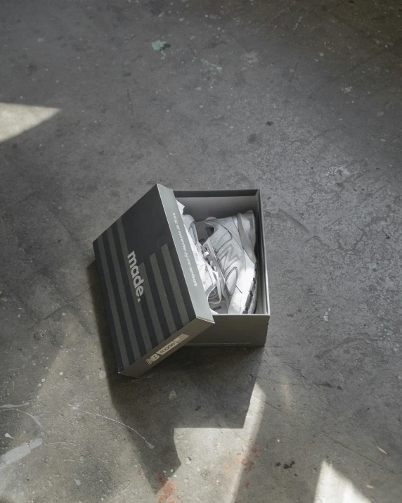 a box of shoes sitting on the ground