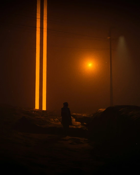 a man walking alone at night with his light on