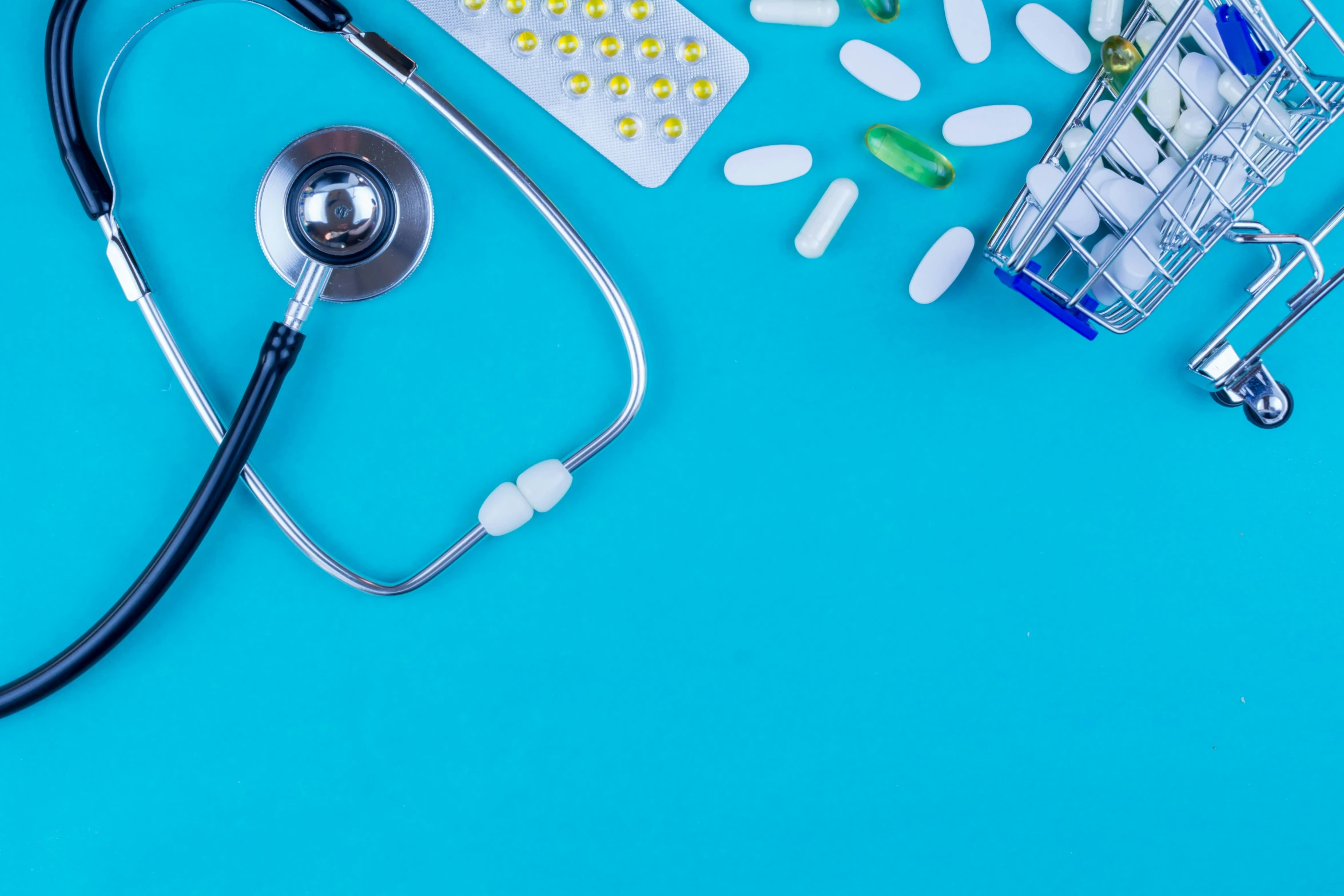 medical items with a stethoscope on a blue background