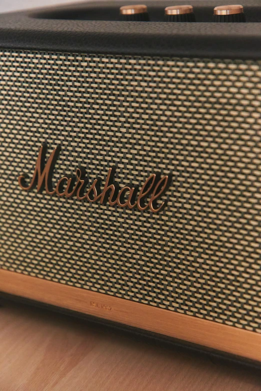 a musical device with words on it sitting on top of a wooden table