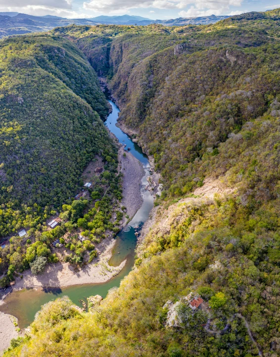 view from air showing steep landscape and river near valley