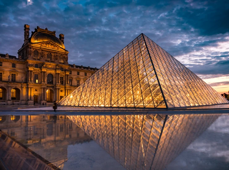 an ancient pyramid with pyramids in front of a museum