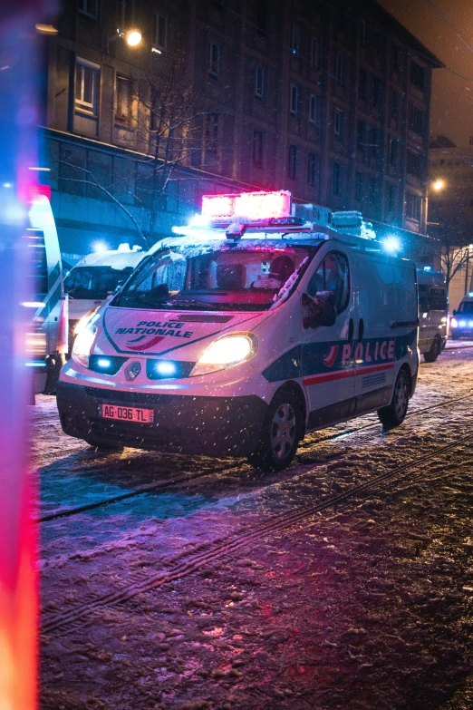 a police car parked next to the curb