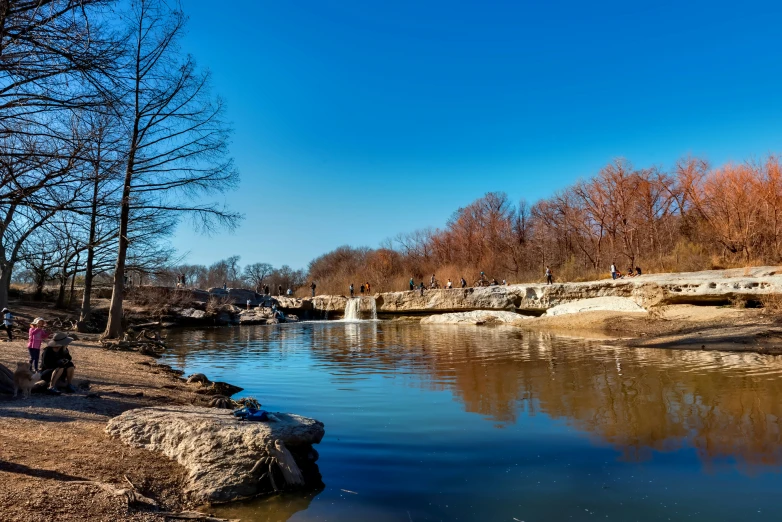 a view of water that appears to be surrounded by rocks and trees