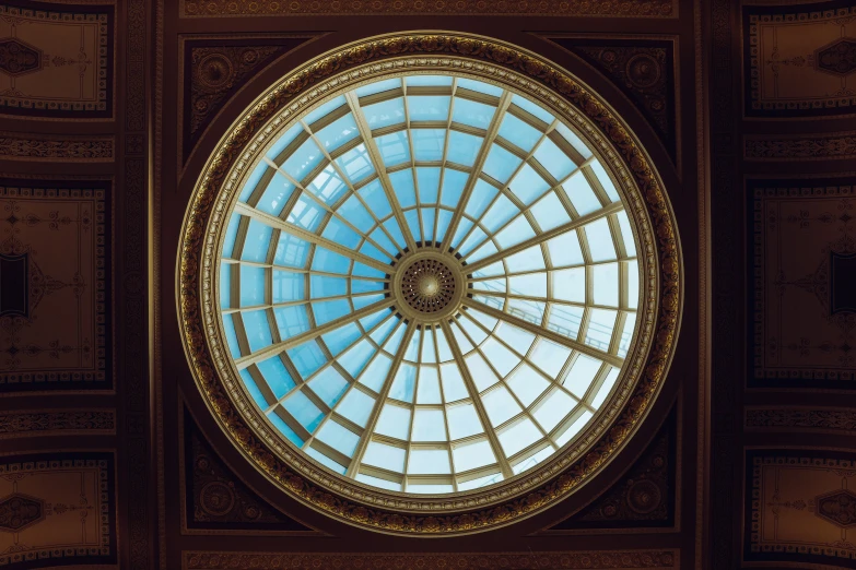 the view of an oval glass ceiling from beneath