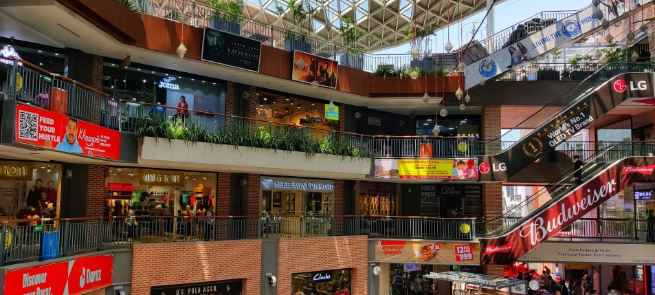 a shopping mall that has multiple floors and large balconies