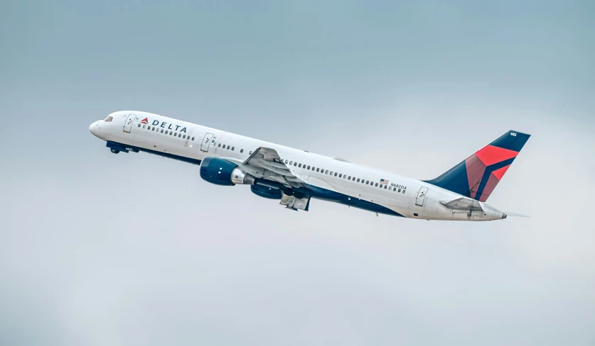 a delta airlines plane flying through the sky