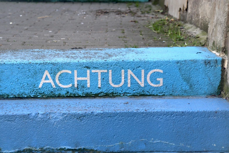 an image of painted steps with the word achtung on them