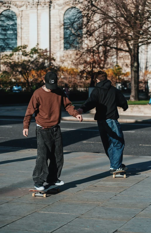 two people on skate boards near each other