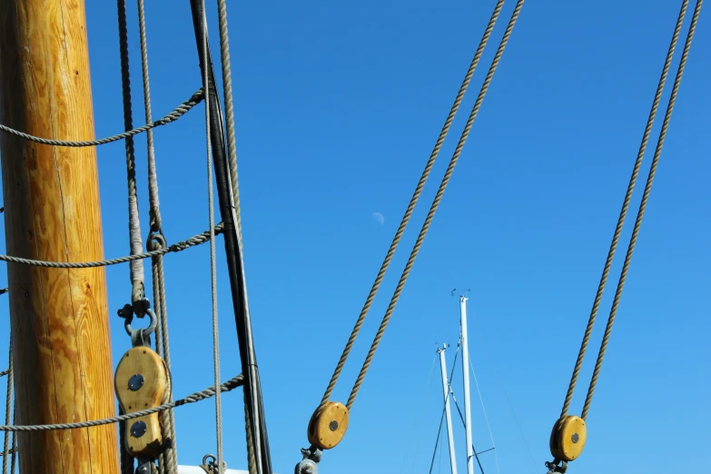 three masts and ropes on a tall ship