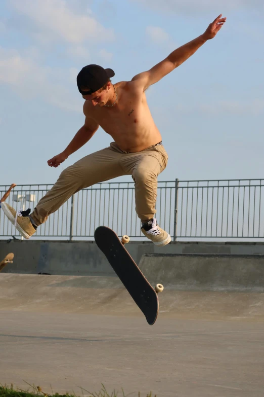 a man skateboards while jumping in the air