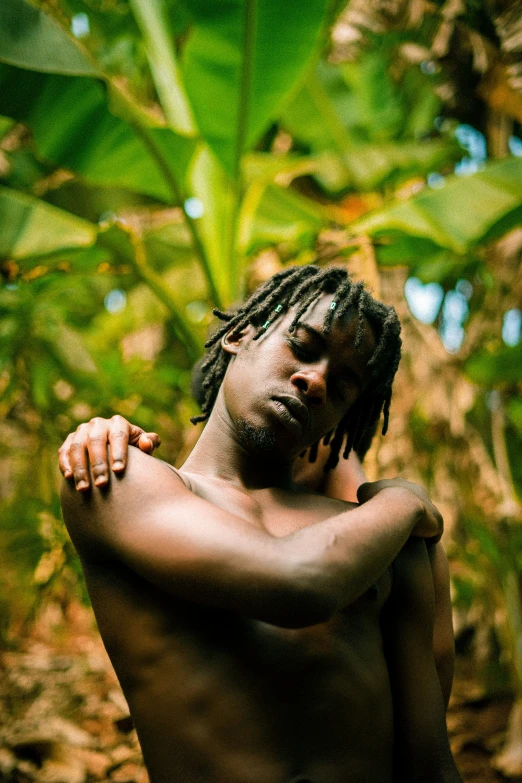 an image of a man without shirt on the jungle