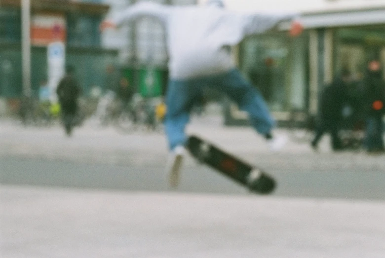 a man jumping a skateboard over another skateboard