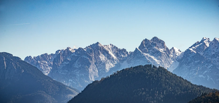 mountains covered with snow under a blue sky