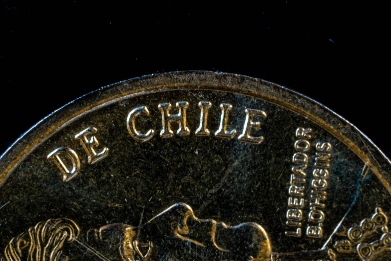 a coin with a black background and a gold border