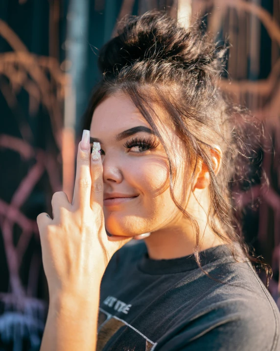 a woman is touching her hand with her fingers