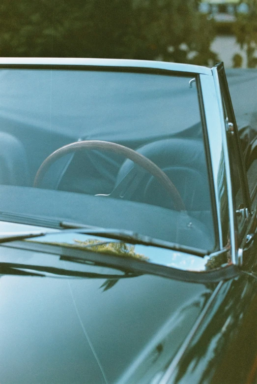 there is a car that is parked outside and it has a steering wheel