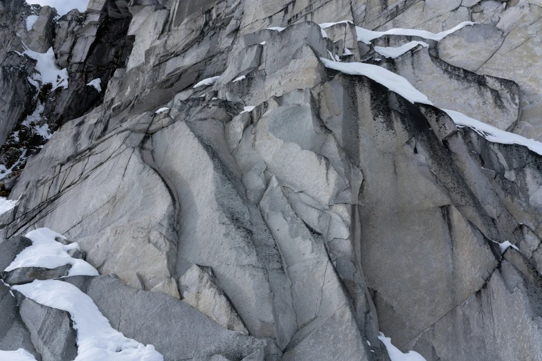 a view from the ground looking at some snow and ice on a mountain