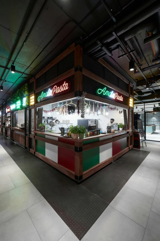 the inside of an indoor market area with lights on