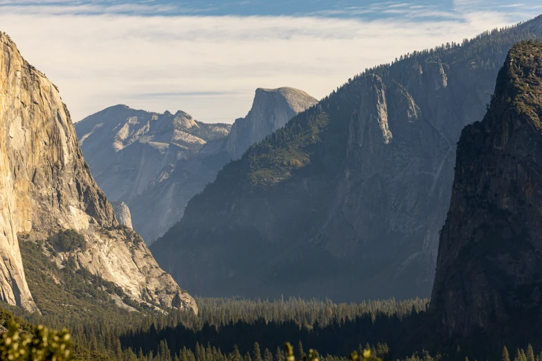 a mountain range with mountains rising into the sky