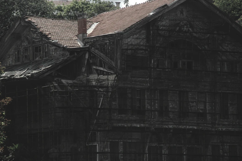 an old house with a rusted roof is shown