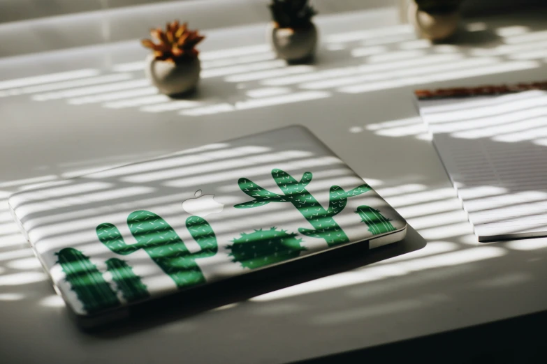 a piece of paper with a cactus painted on it