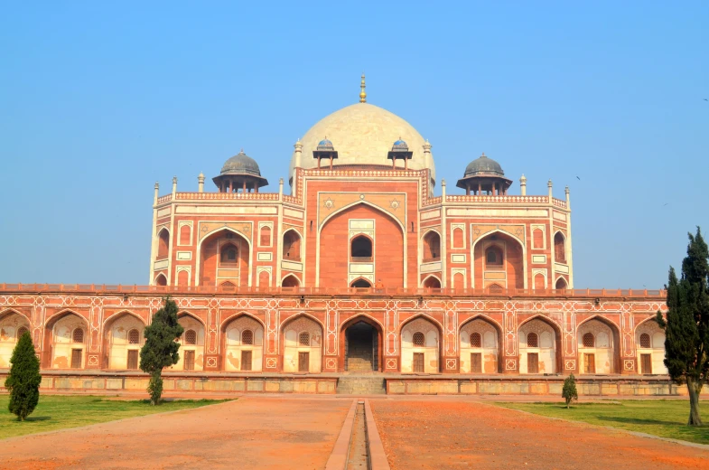 a large, old building with multiple domes on the roof